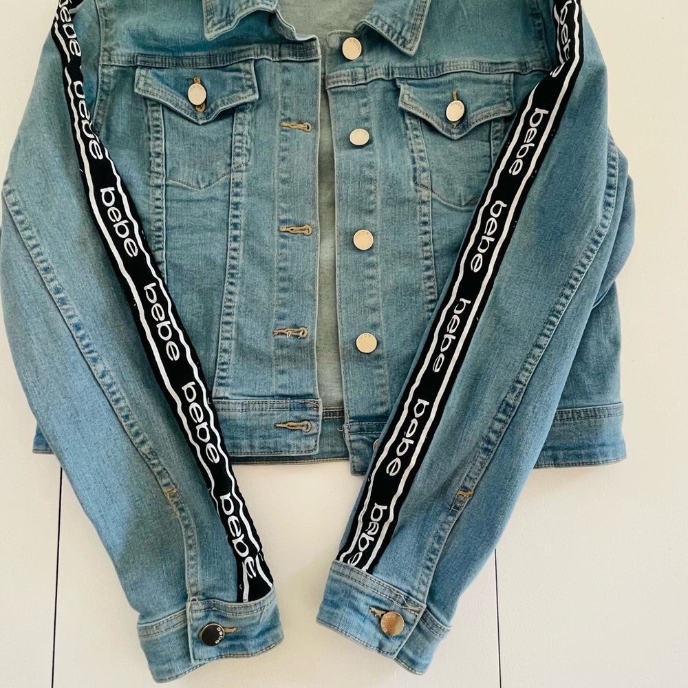 Bebe denim jacket size Medium for women.